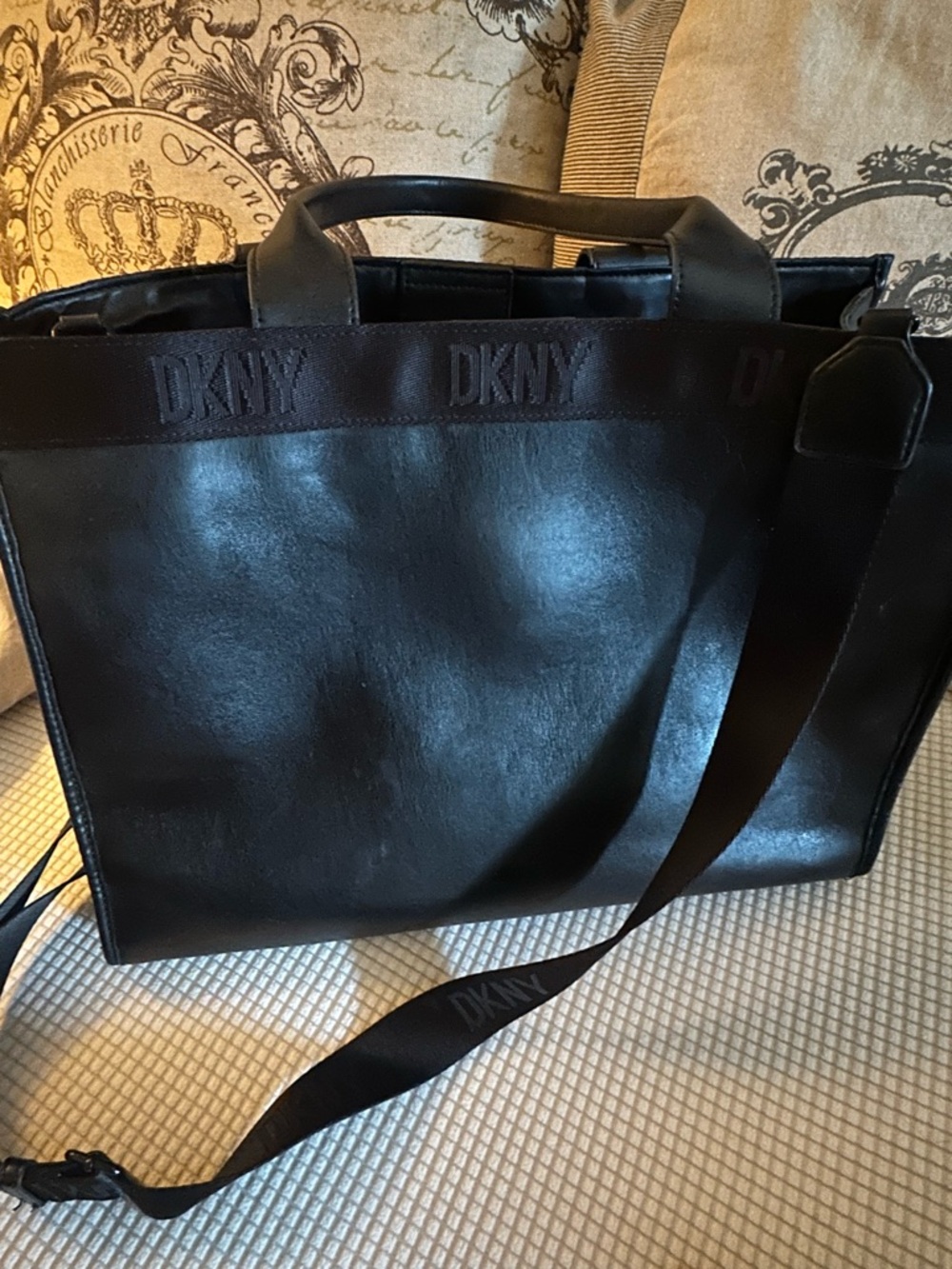 DKNY Large black bag with top handles and shoulder straps. with Logo Webbing.